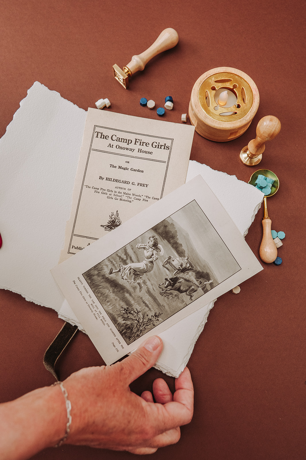 The original pages from inside the book — displayed by hand